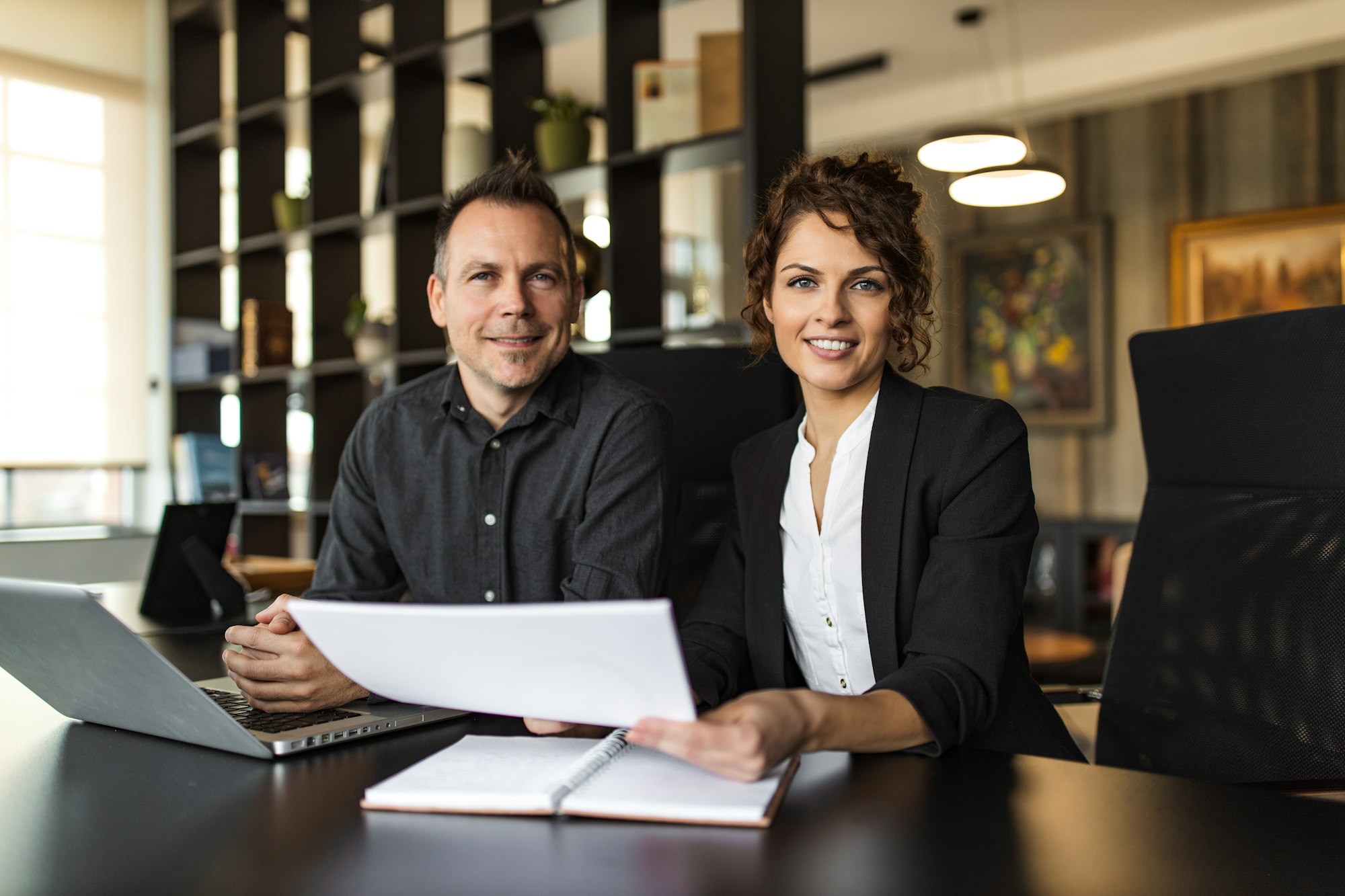 Portrait of a two cheerful HR managers at work.